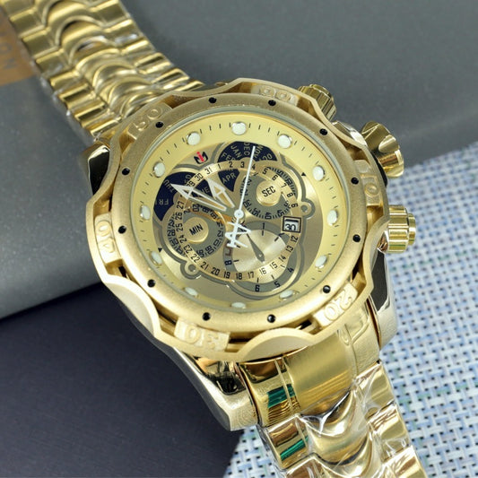 Gold wristwatch with detailed face on a textured surface